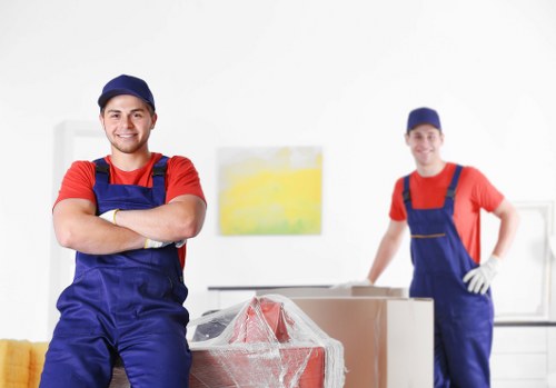 Professional packers organizing household items in Storage Ruislip
